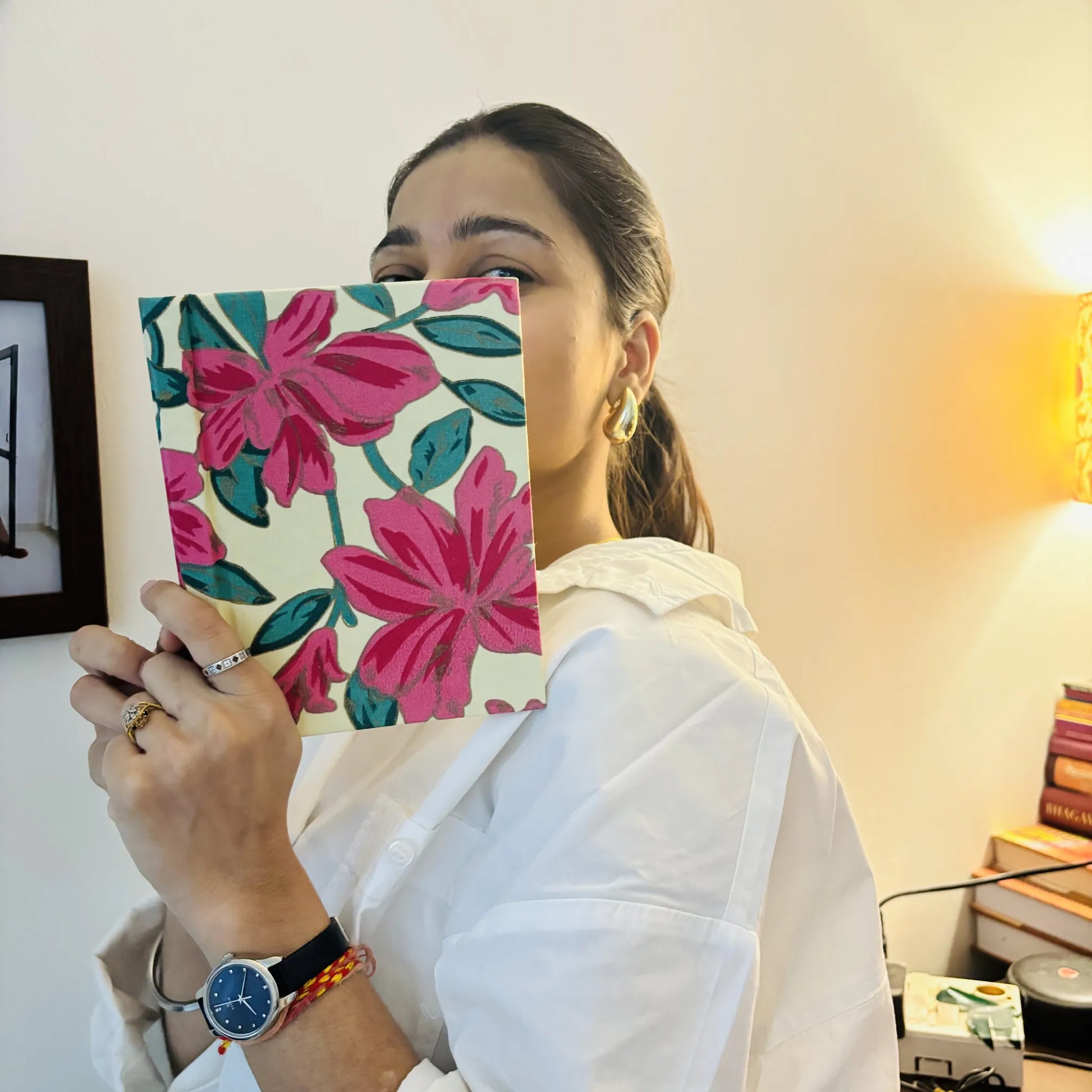 Handmade paper hardbound journal in bloom and reflect - holding view