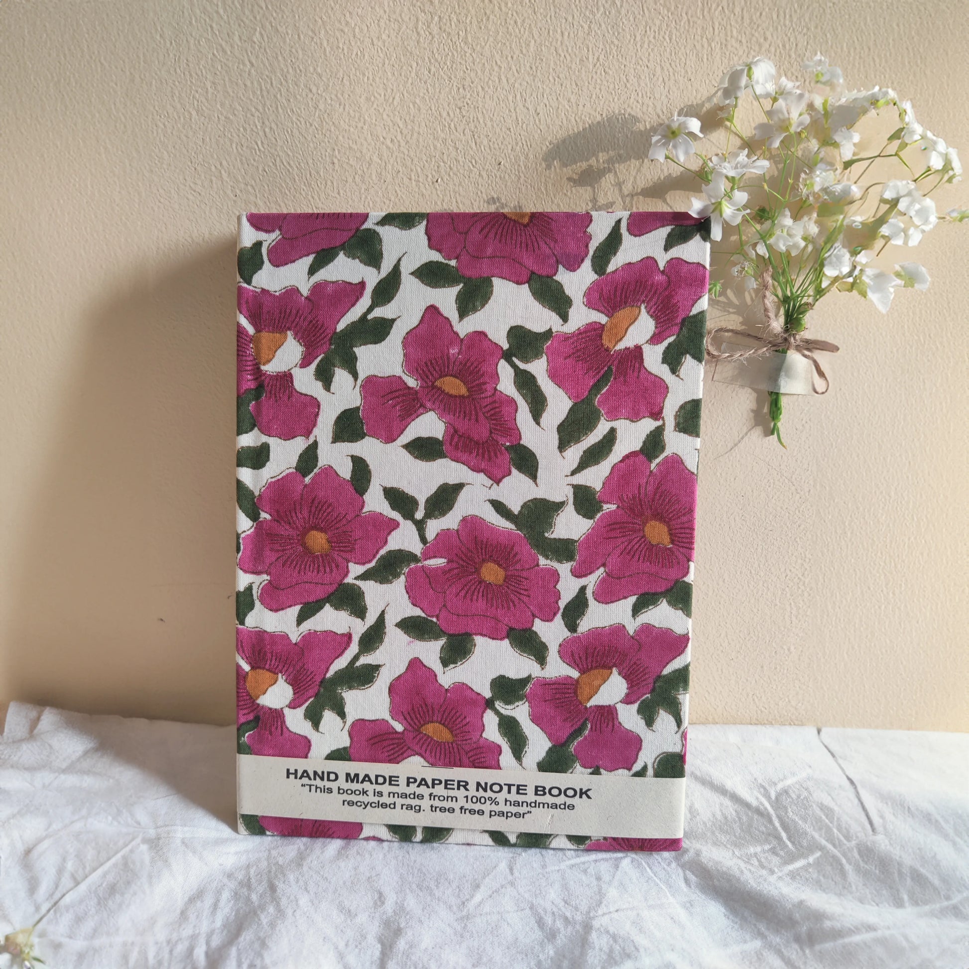 Handmade paper notebook with pink floral design