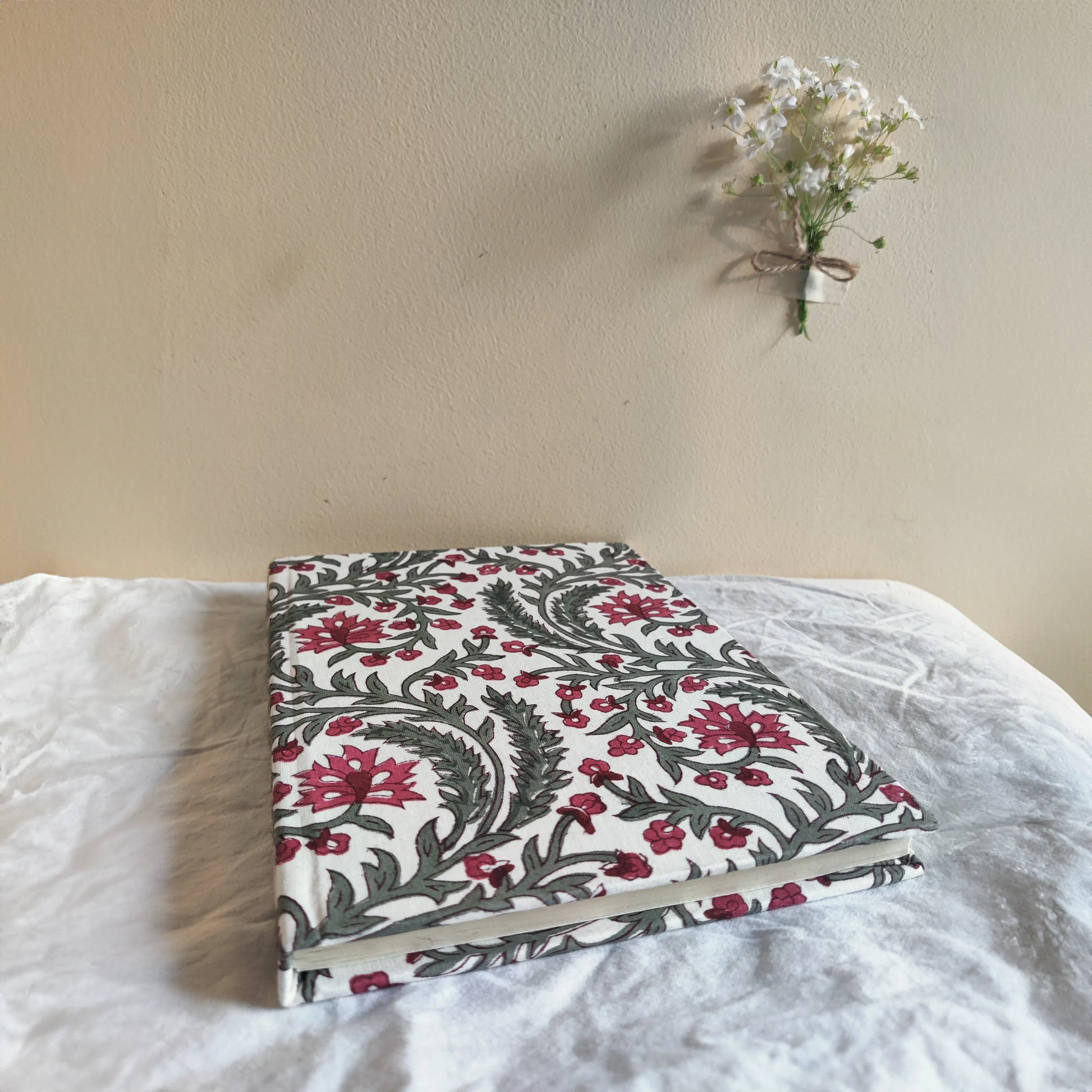 Handmade paper hardbound journal in rosaire - flatlay view