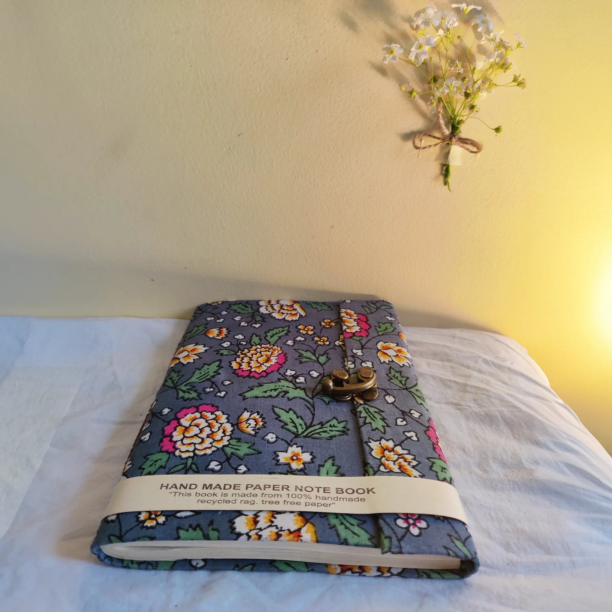 Handmade paper lock journal in aurorae - flatlay view