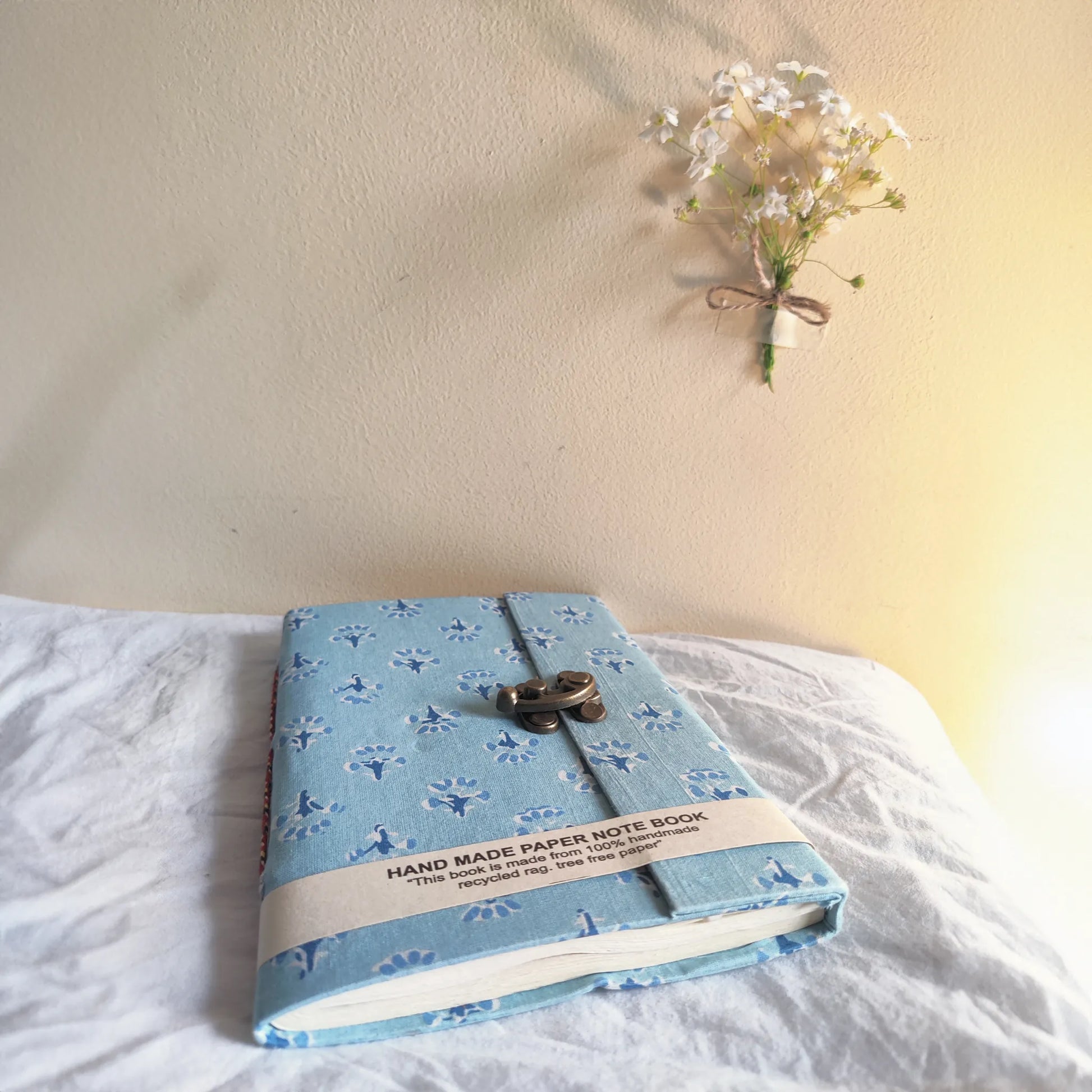 Handmade paper lock journal in azureflor - flatlay view