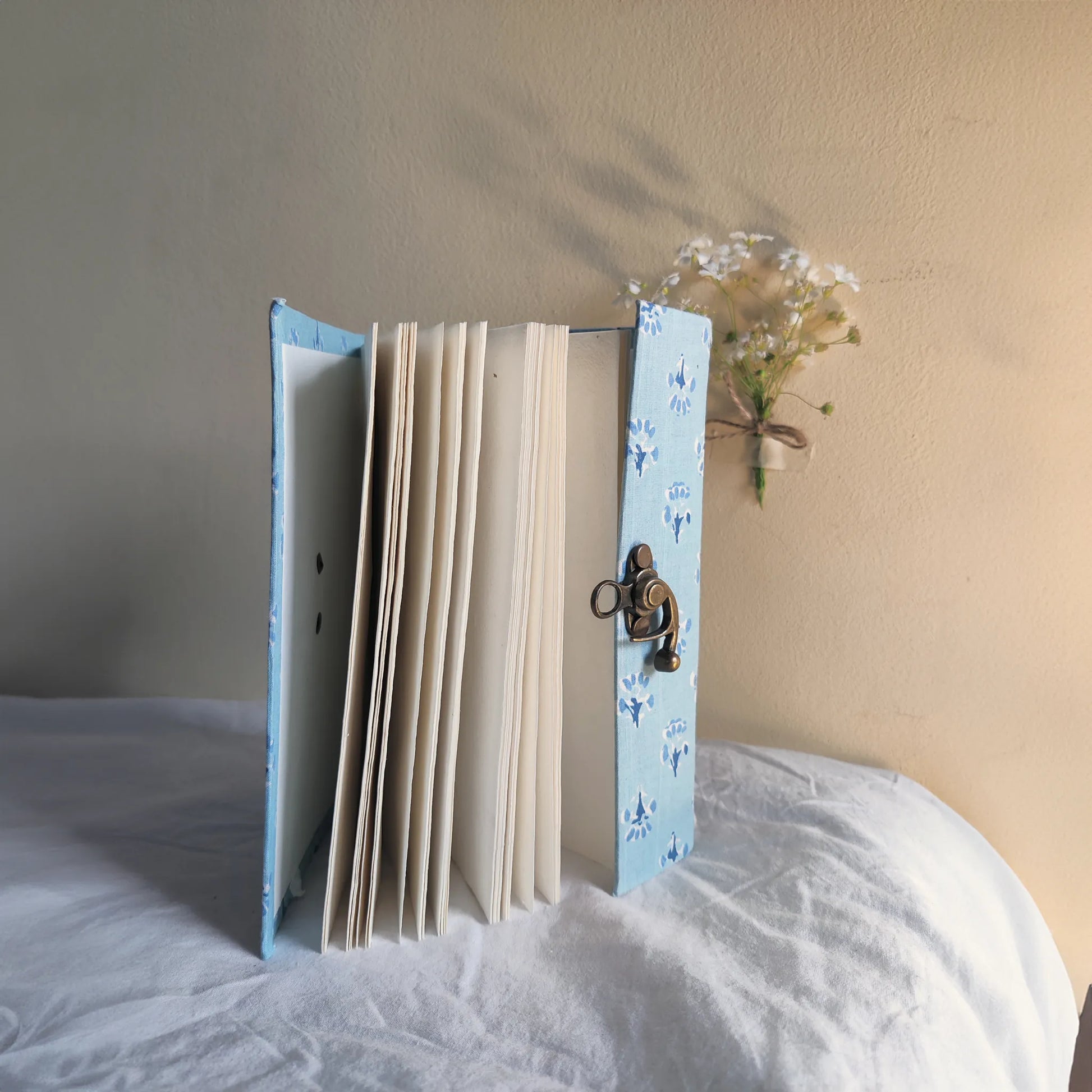 Handmade paper lock journal in azureflor - open view