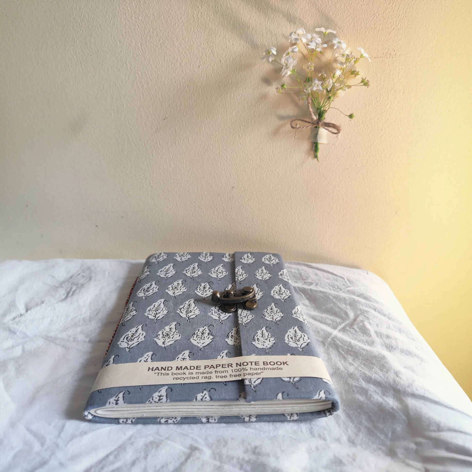 Handmade paper lock journal in greybloom - flatlay view