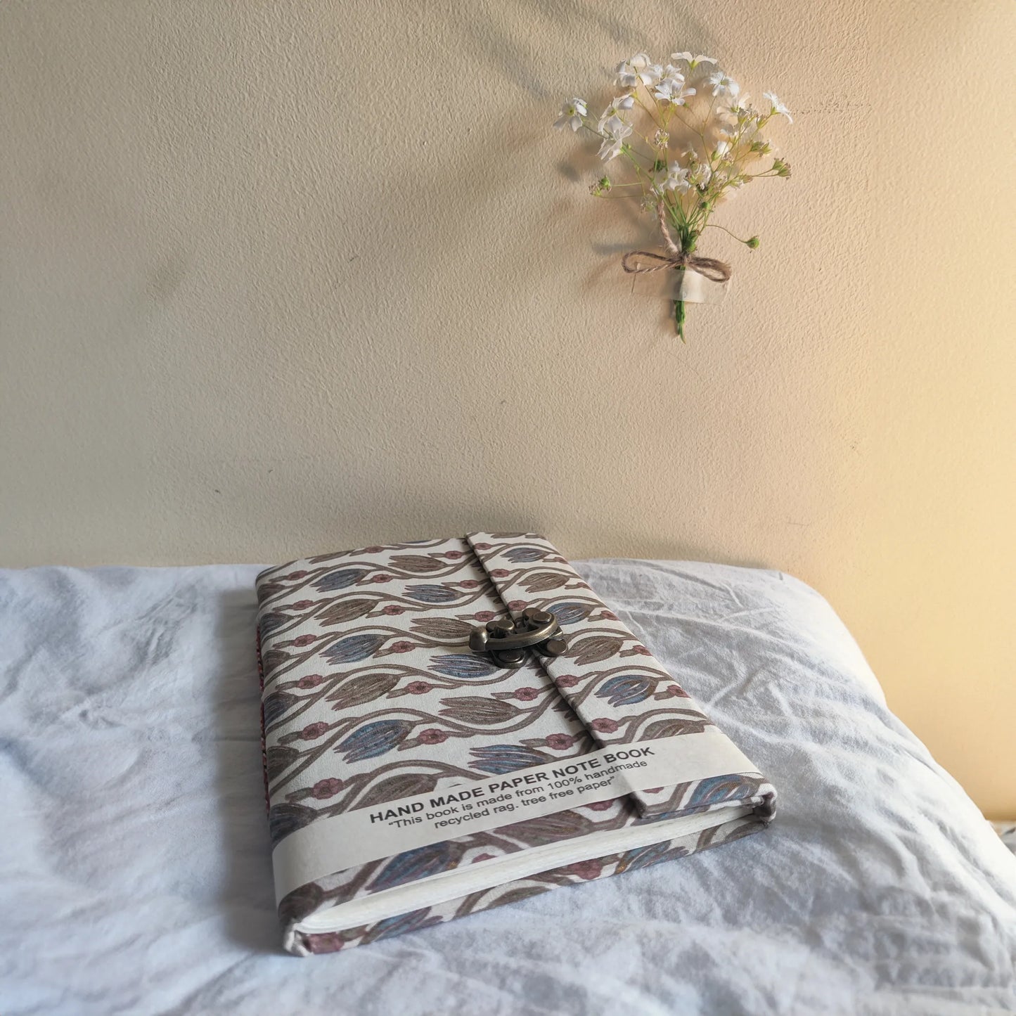 Handmade paper lock journal in indigem - flatlay view