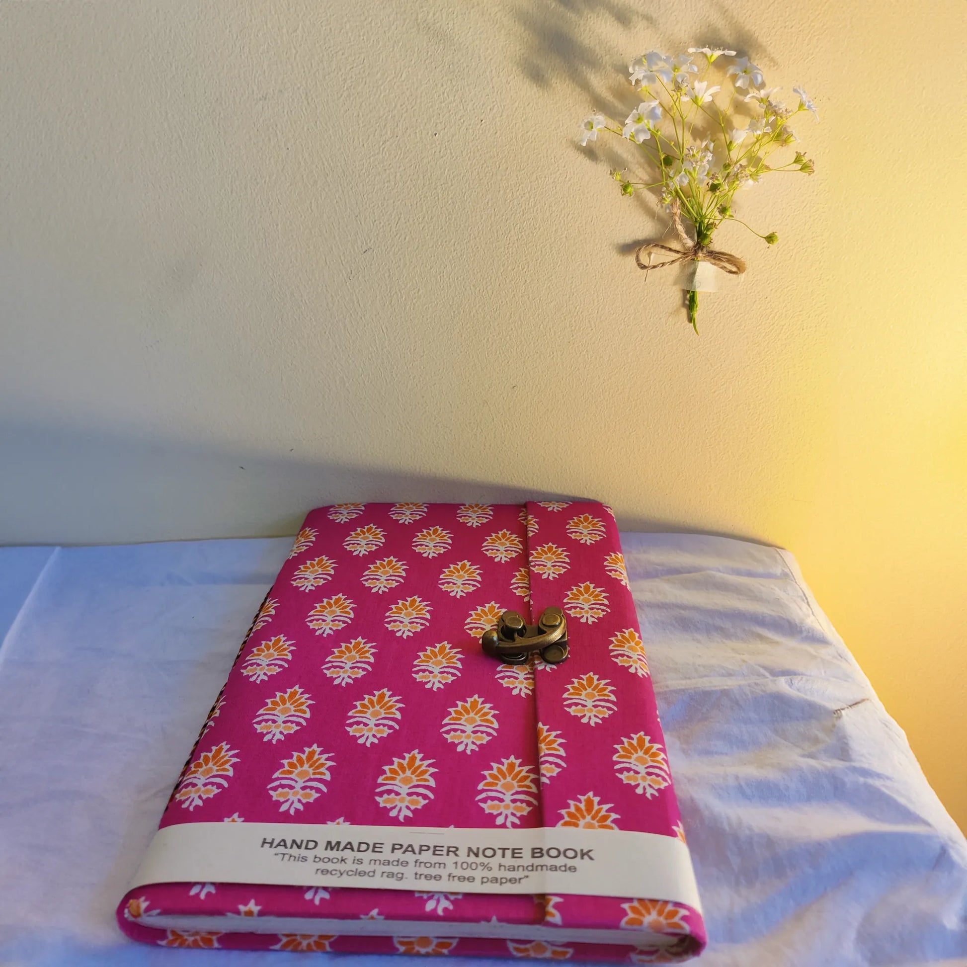 Handmade paper lock journal in magentea - flatlay view