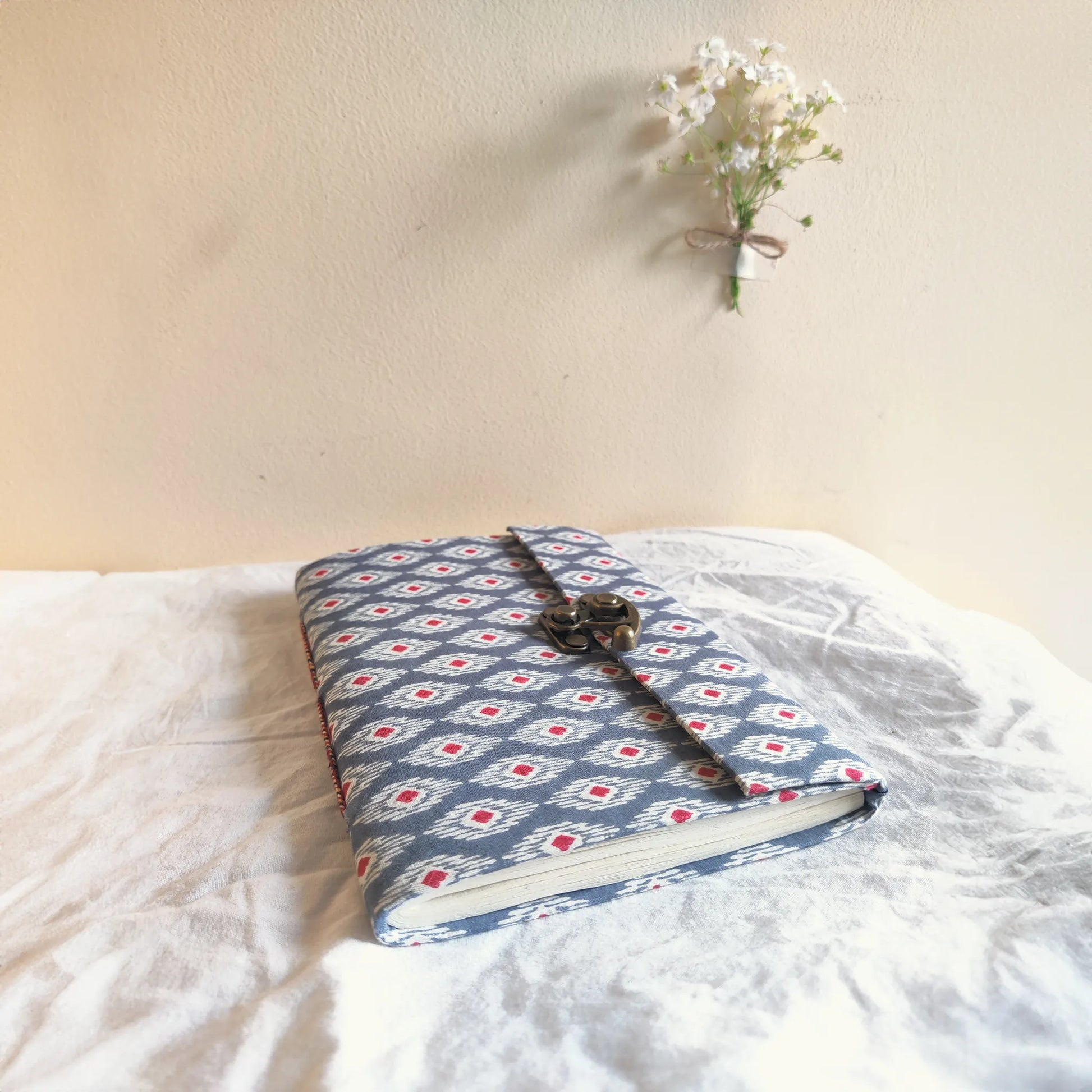 Handmade paper lock journal in navynest - flatlay view