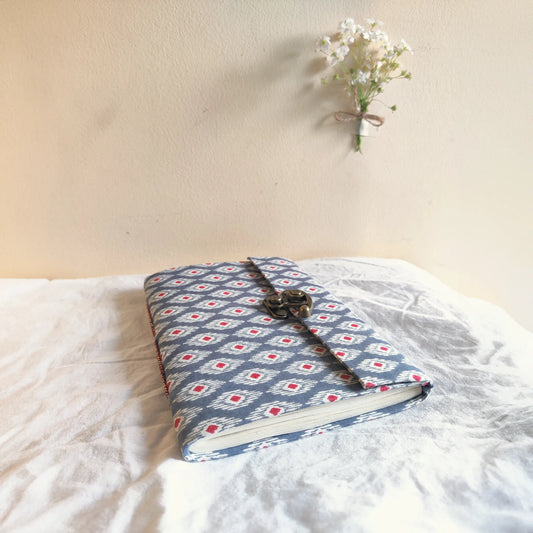 Handmade paper lock journal in navynest - flatlay view