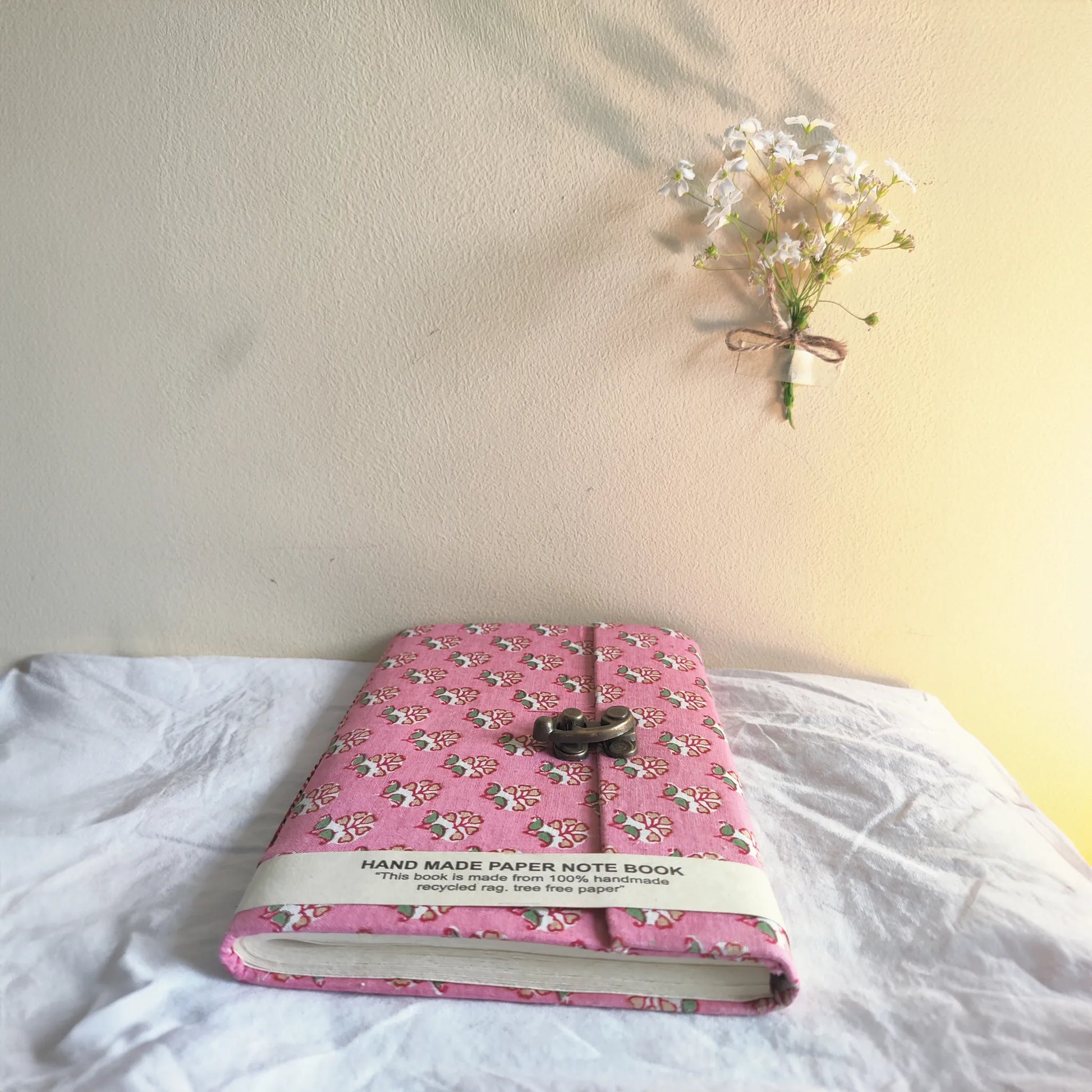 Handmade paper lock journal in roselit - flatlay view