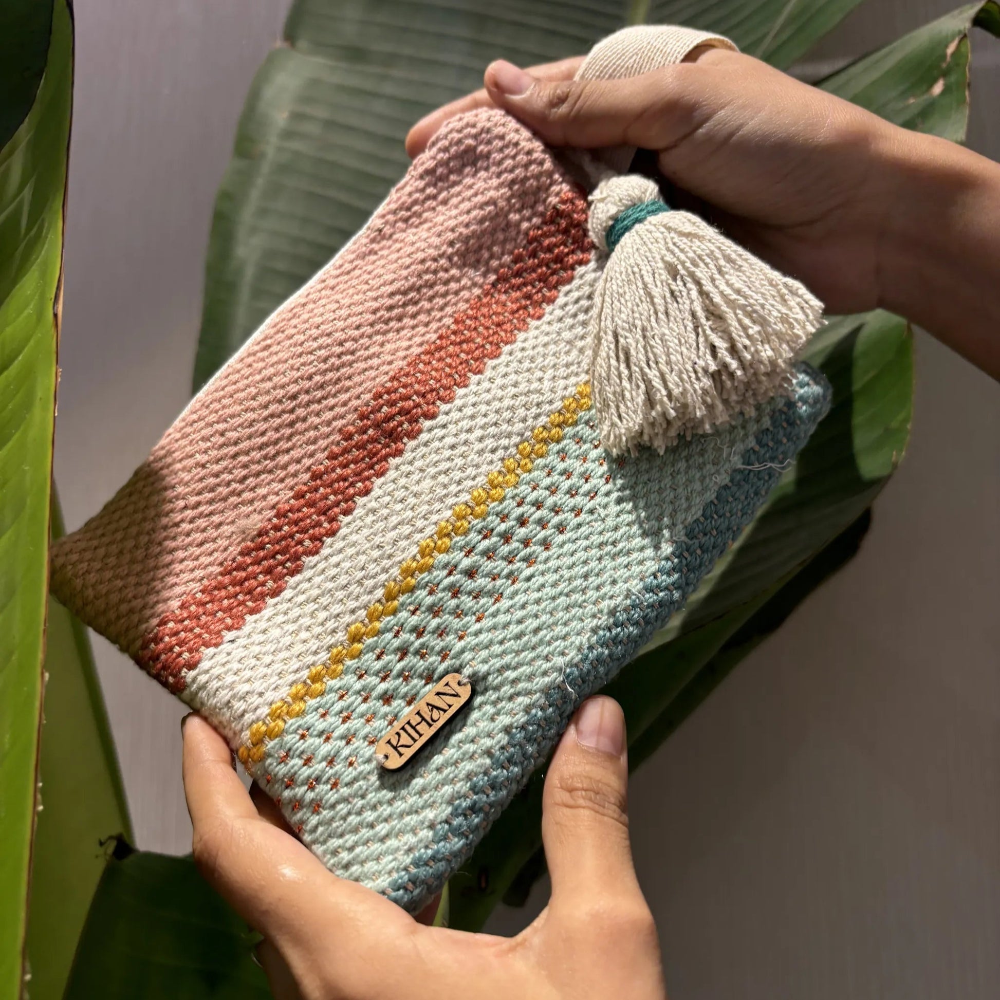 Handloom pouch multipurpose in earth weave - holding view