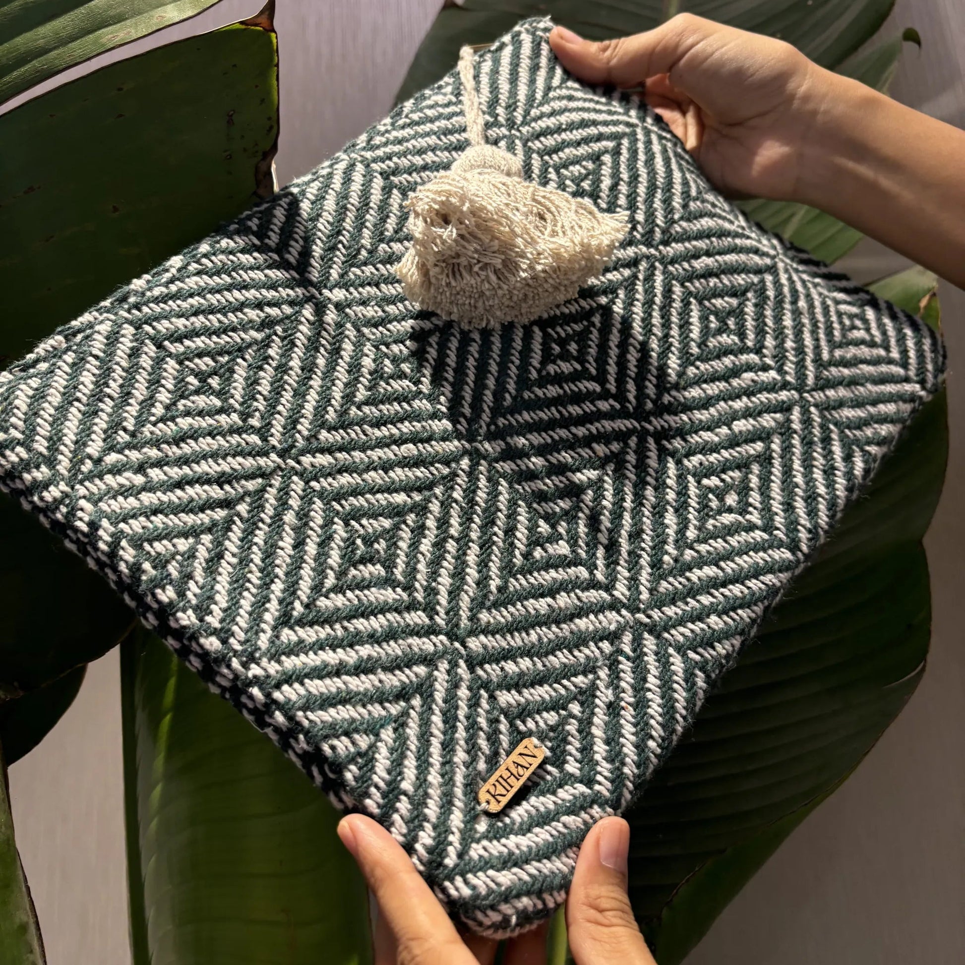 Handloom pouch multipurpose in emerald mosaic - holding view