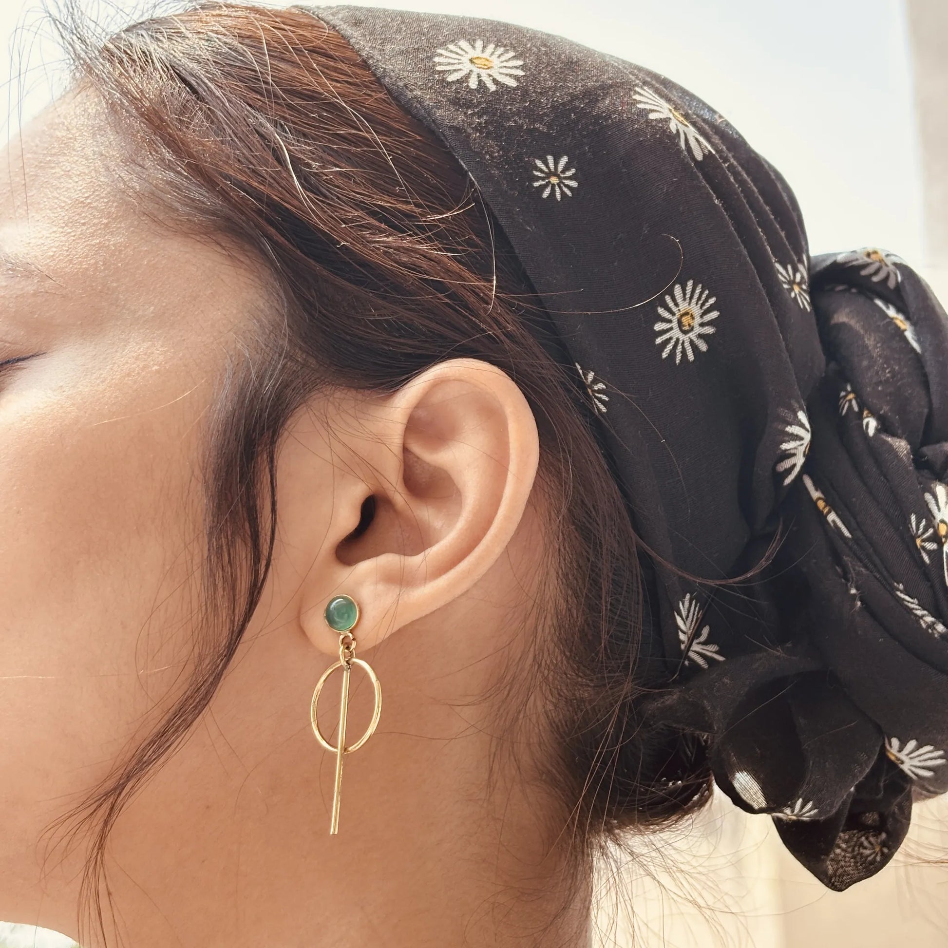 Model wearing green onyx orbit drops earrings