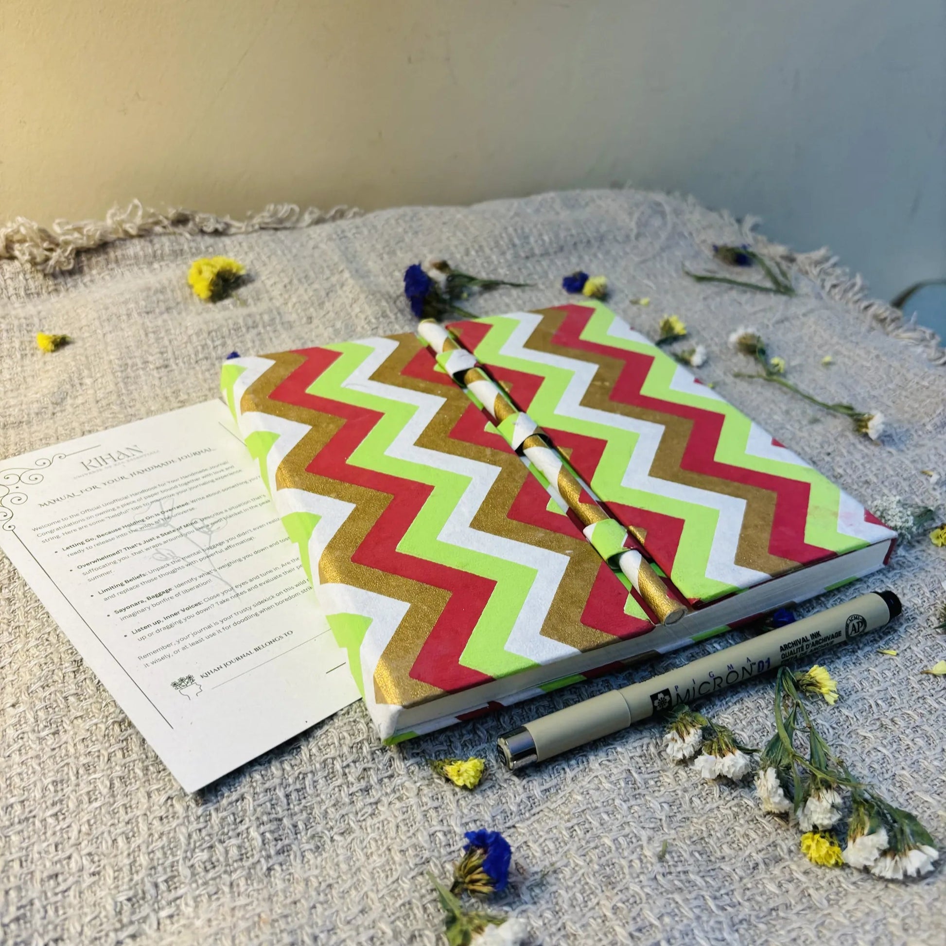 Handmade paper pen journal in chevron - flatlay view