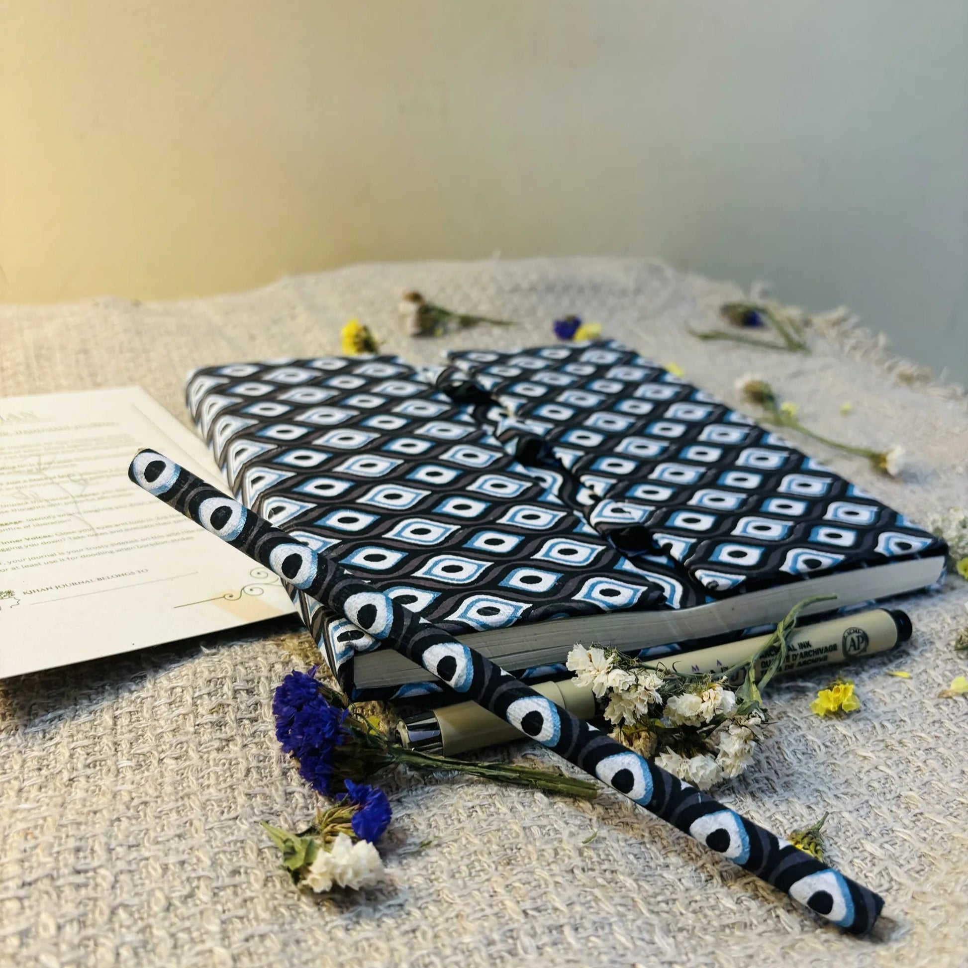 Handmade paper pen journal in evil eye - pen view