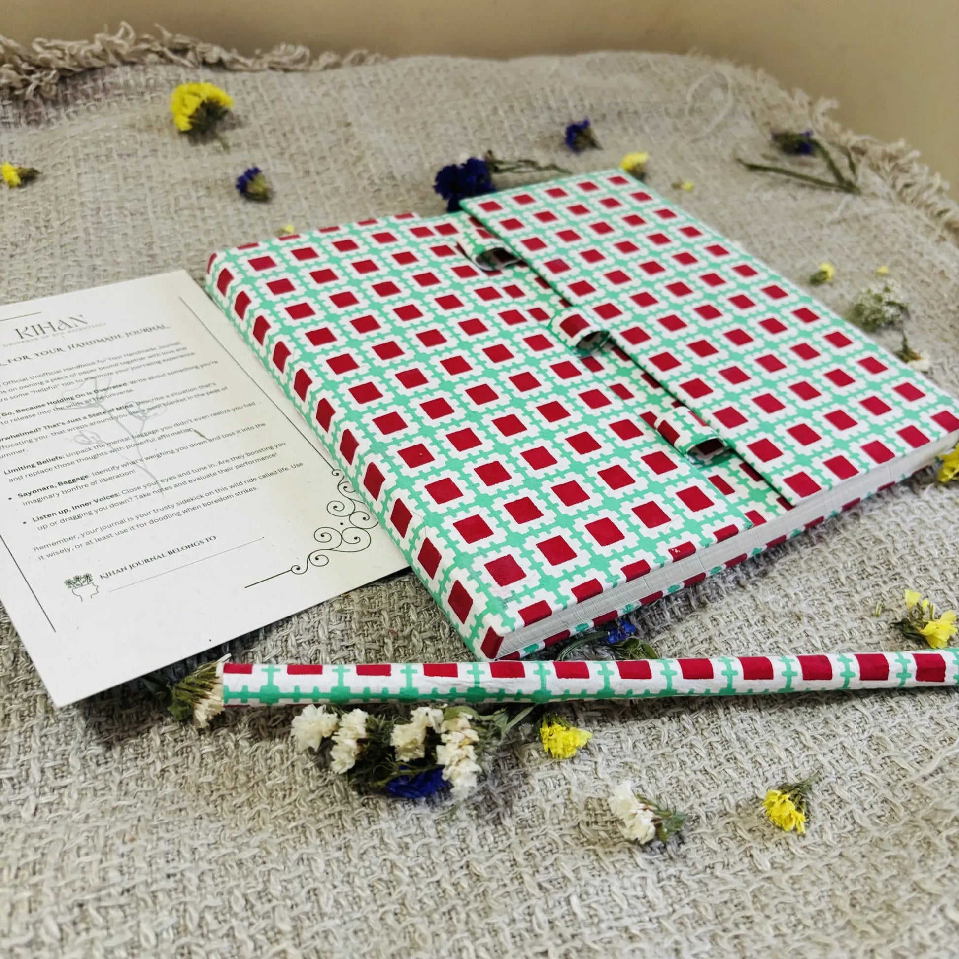 Handmade paper pen journal in geometric harmony - flatlay view