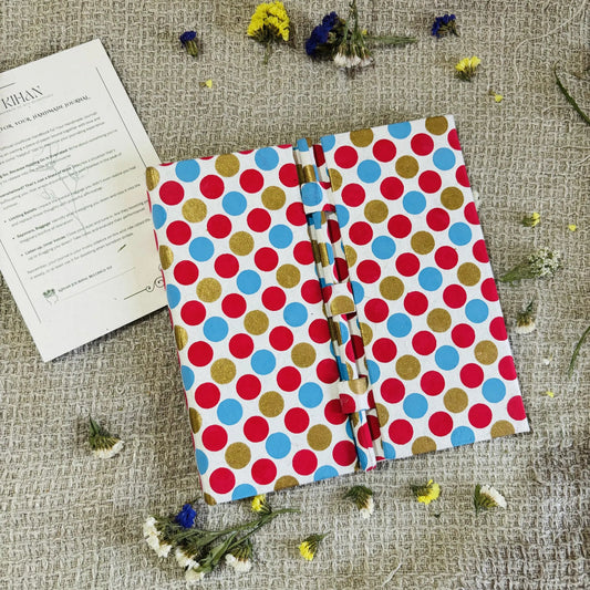 Handmade paper pen journal in pinkadoodle - flatlay view