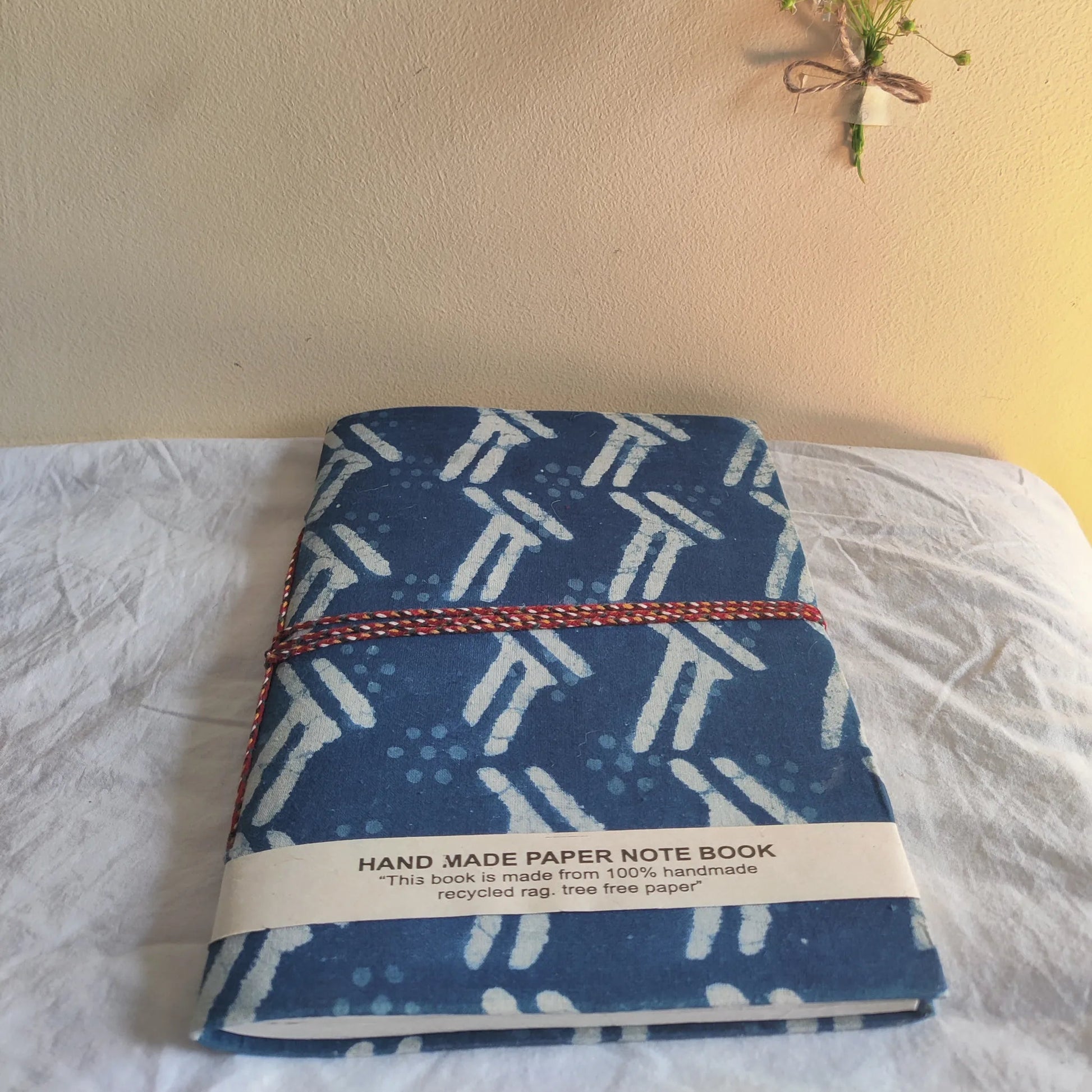 Handmade paper rope journal in indigo arrow - flatlay view