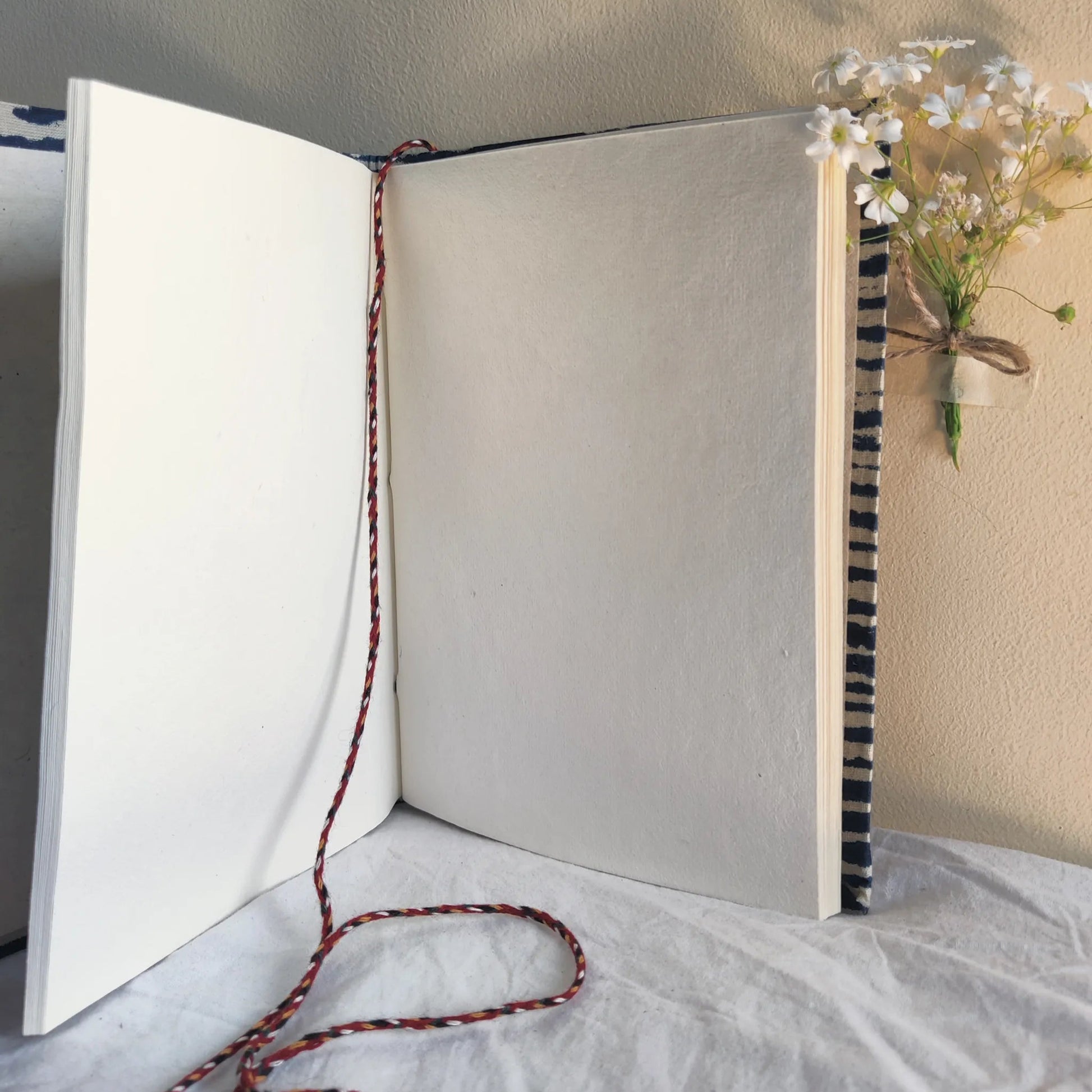 Handmade paper rope journal in ocean waves - open view