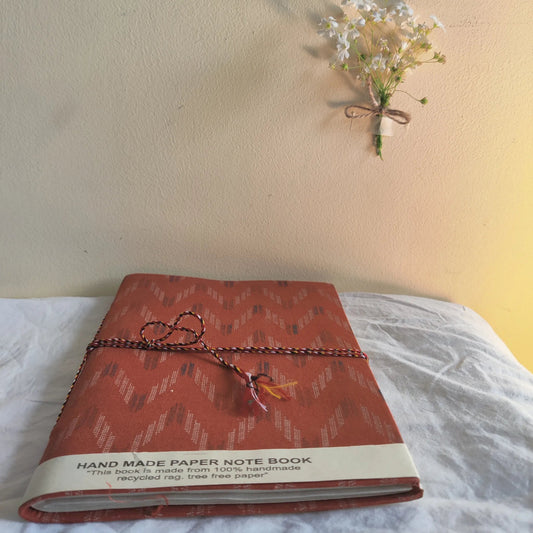 Handmade paper rope journal in rustic chevron - flatlay view