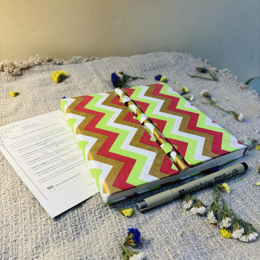 Handmade paper pen journal in chevron - flatlay view