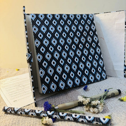 Handmade paper pen journal in evil eye - open view