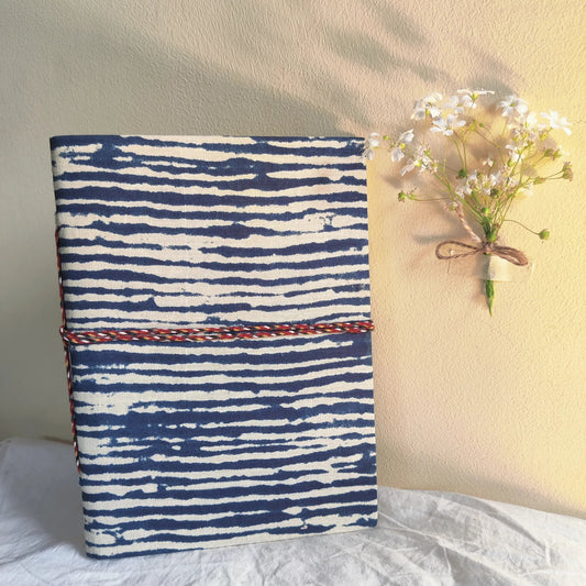 Handmade paper rope journal in ocean waves - front view